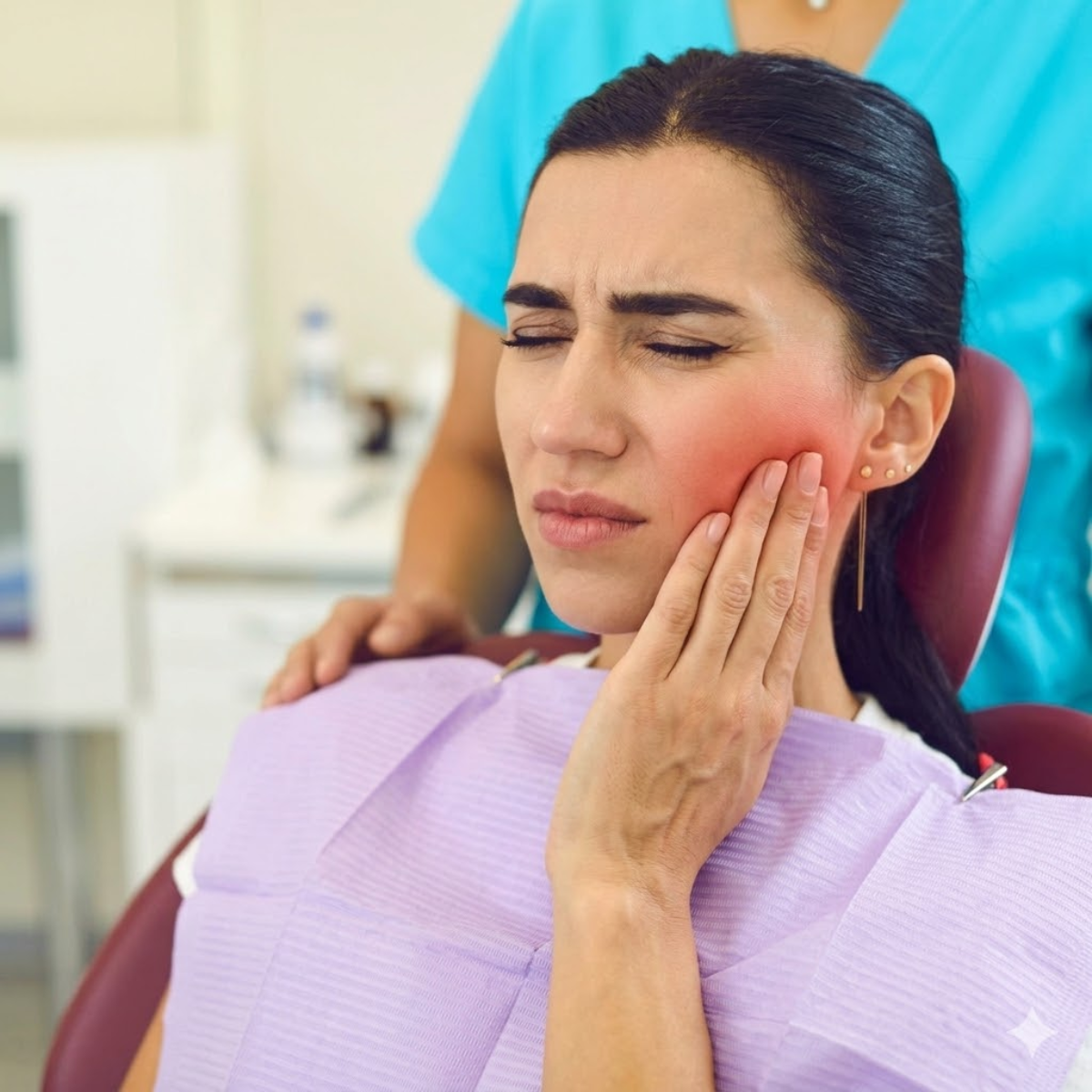Woman experiencing ear and jaw pain after tooth extraction
